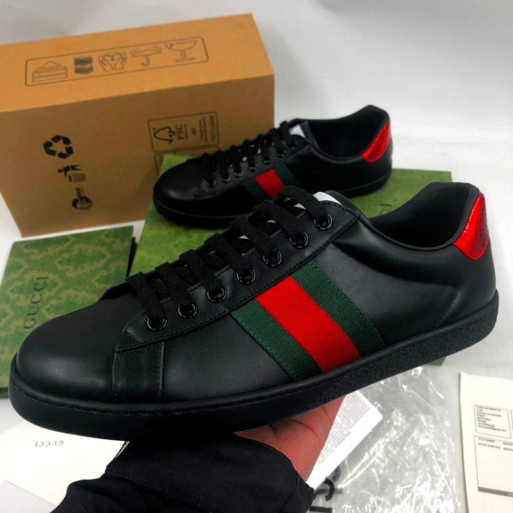 Men Gucci sneakers black, size 9 1/2, leather top an plastic soles, still brand